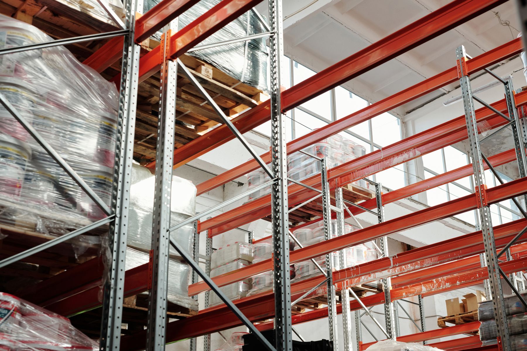 Wrapped pallets stored on warehouse racks